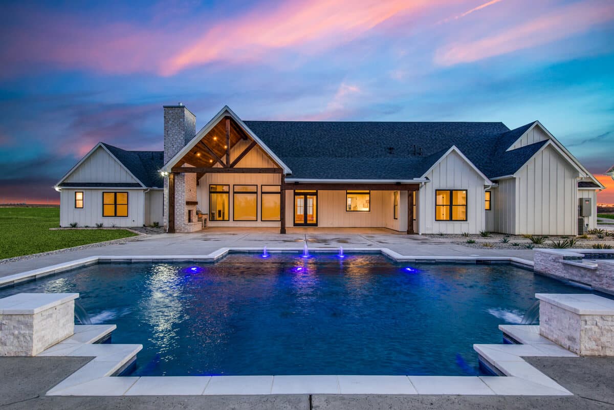 Custom pool house at sunset — Tioga, TX — J C Boyd Custom Builders
